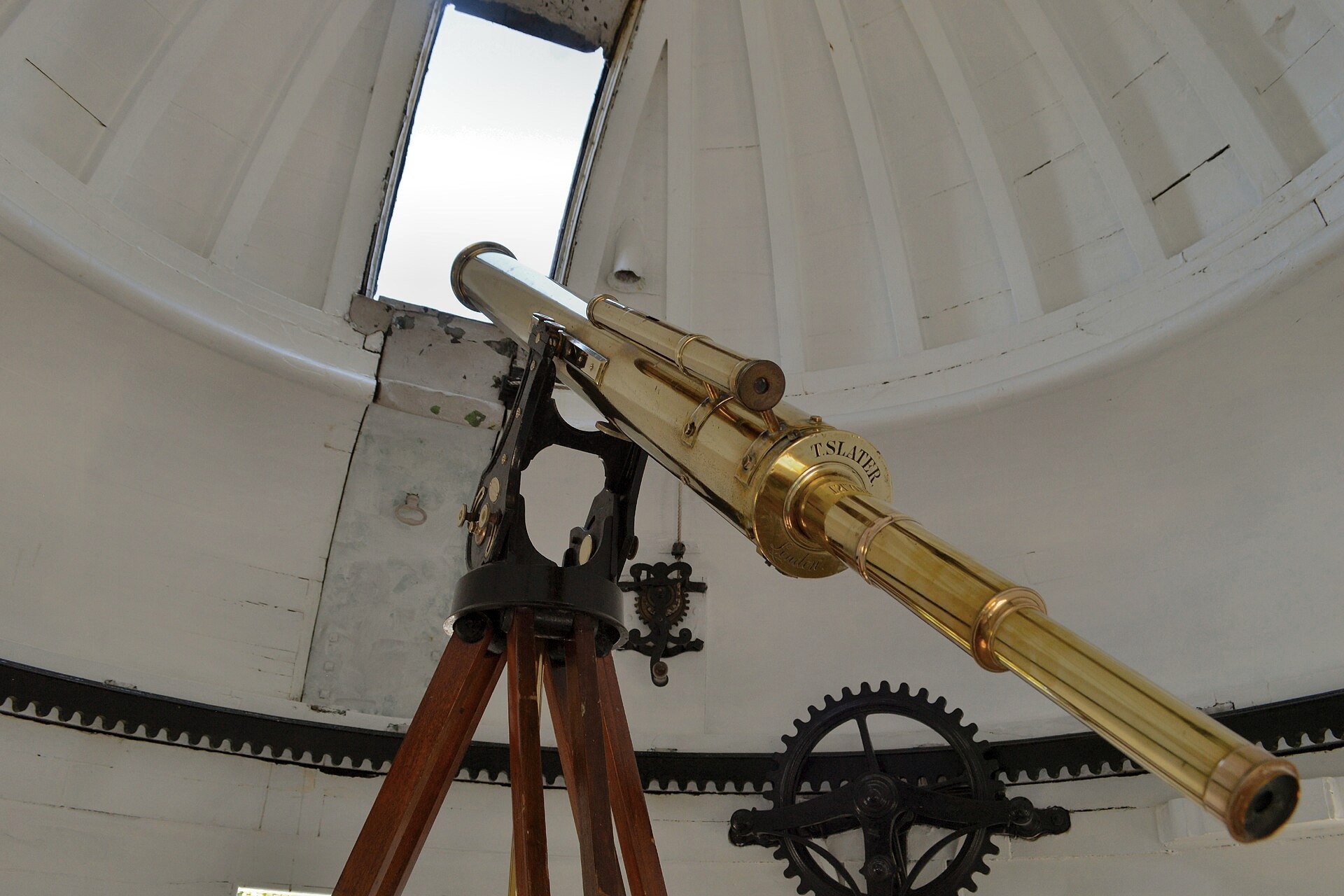 A faint point of planetary light beside a brighter star in a telescope image
